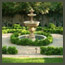 CA Italian garden with boxwood knot gardens, fountain, and lawn near Pasadena.