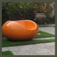 A CA modern garden path with pavers, synthetic turf, modern outdoor furniture, garden balls, and bamboo