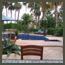Pool and flagstone patio of a Rancho Santa Fe estate with an outdoor kitchen tiled bar in 