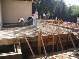 landscape patio being formed during construction with workers installing rebar near Pasadena