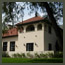 Before image of an Italian garden in Los Angeles with a house  and lawn near 
