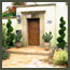 CA Mediterranean garden with spiral junipers, succulents, and bay laurel in Los Angeles.