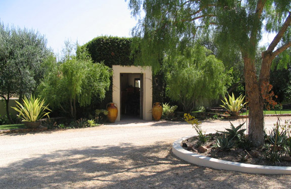 Rancho Santa Fe estate framed by a CA succulent garden with driveway and Spanish 