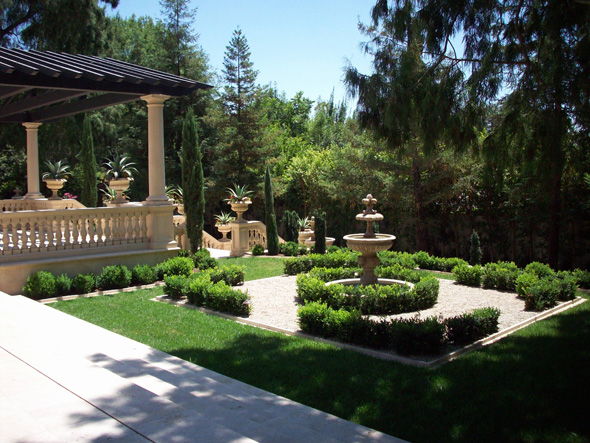 a Formal Italian garden with trellis, fountain, knot garden, patio, balustrades, urns, and boxwood near Pasaden